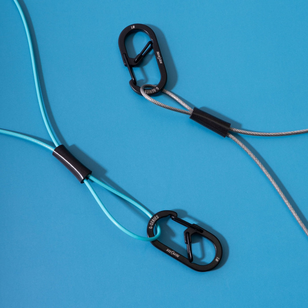 GRAPLRZ Verza Mini Utility Lanyards in aqua and silver on a blue background