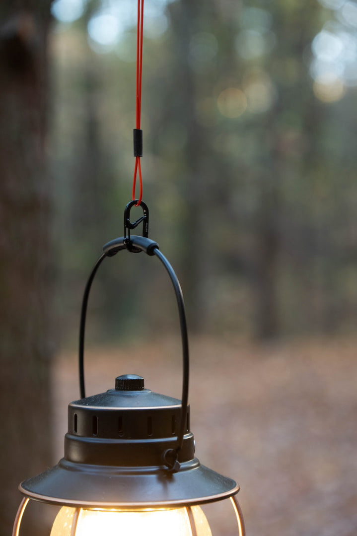 Lantern hanging from red GRAPLRZ VERZA Multi Use Lanyard
