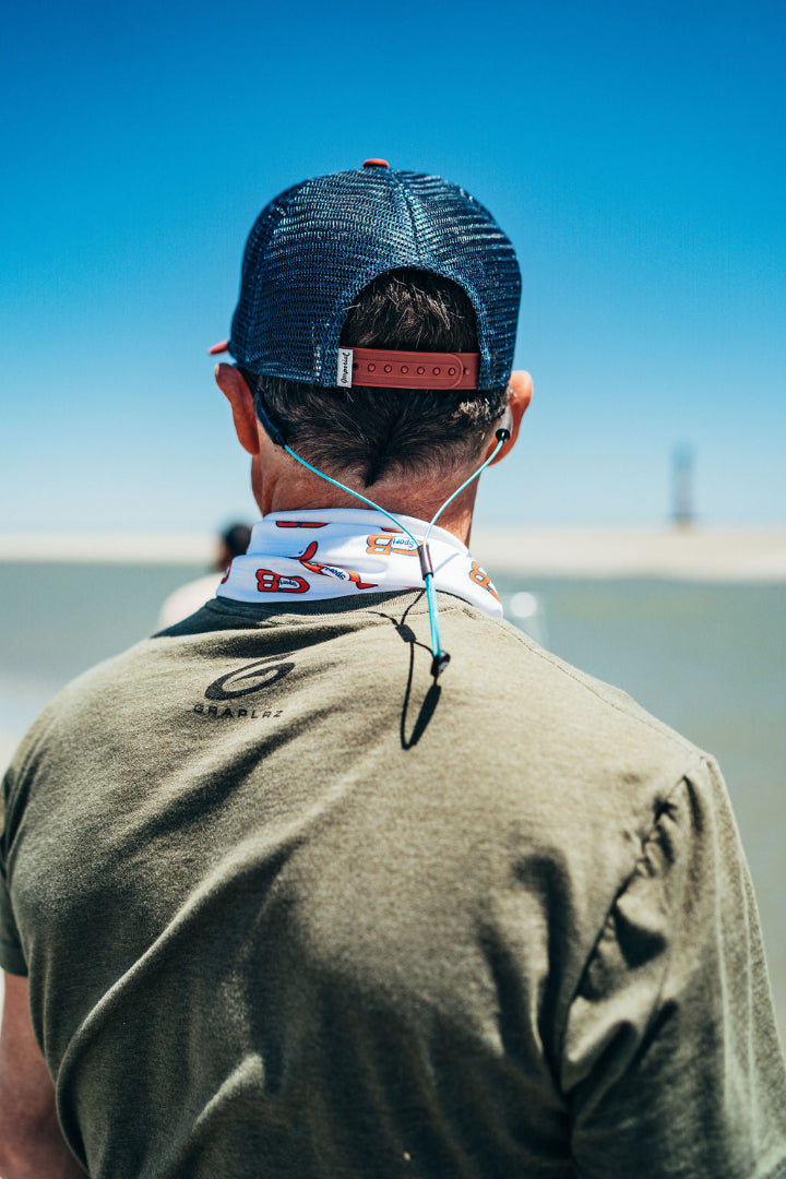 Man with his back turned wearing aqua GRAPLRZ